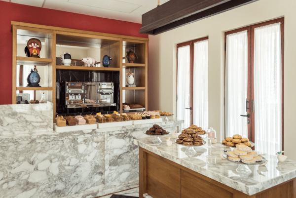 bright cafe setting with fresh pastries and bread